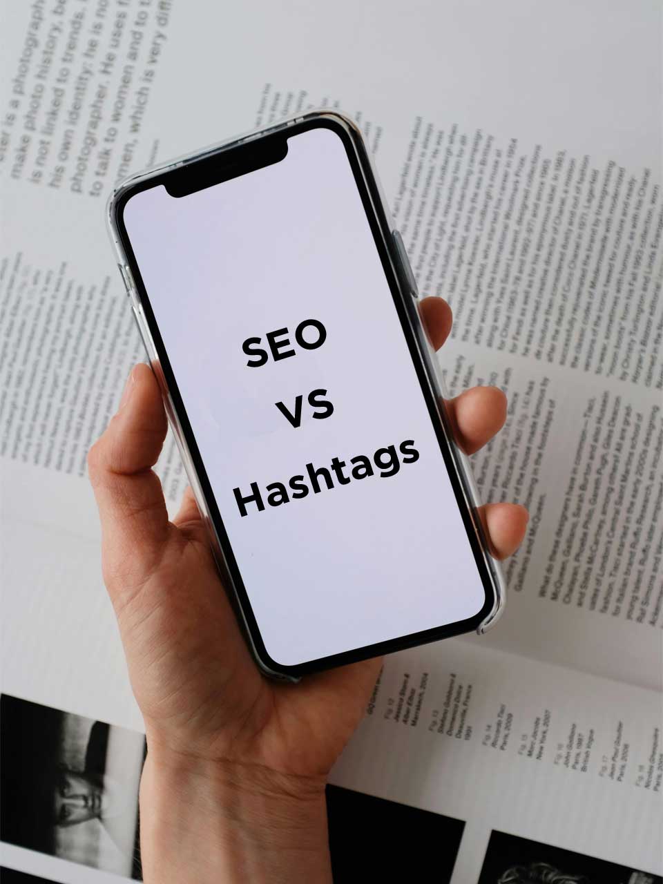 A photo showing a mobile and on the mobile it is showing SEO VS Hashtags