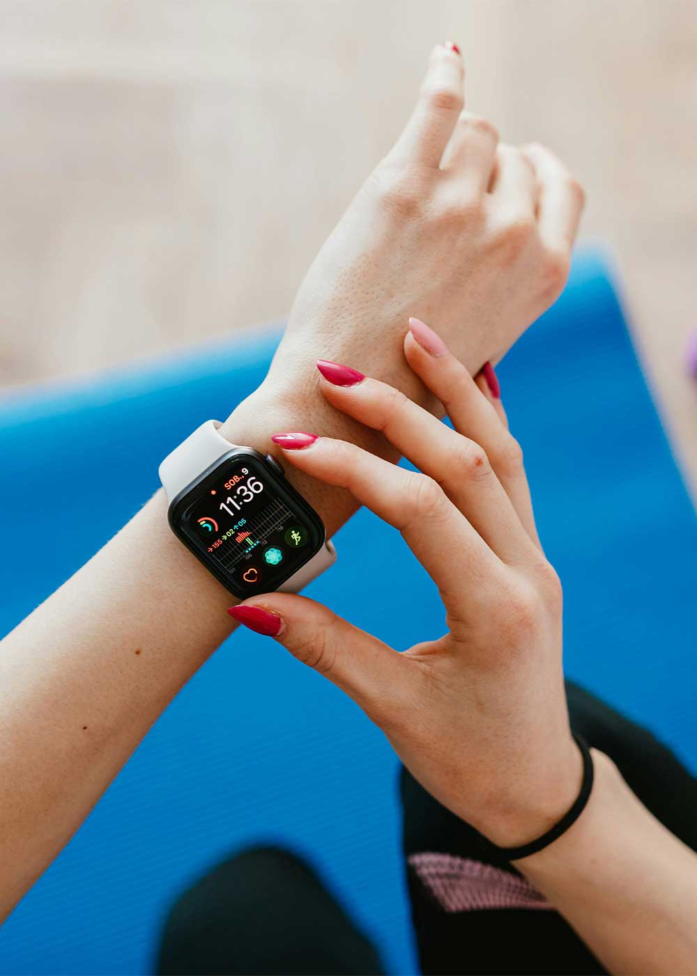 a photo of a lady's hand with fitness tracker as an example of Pay-Per-Sale (PPS) affiliate program